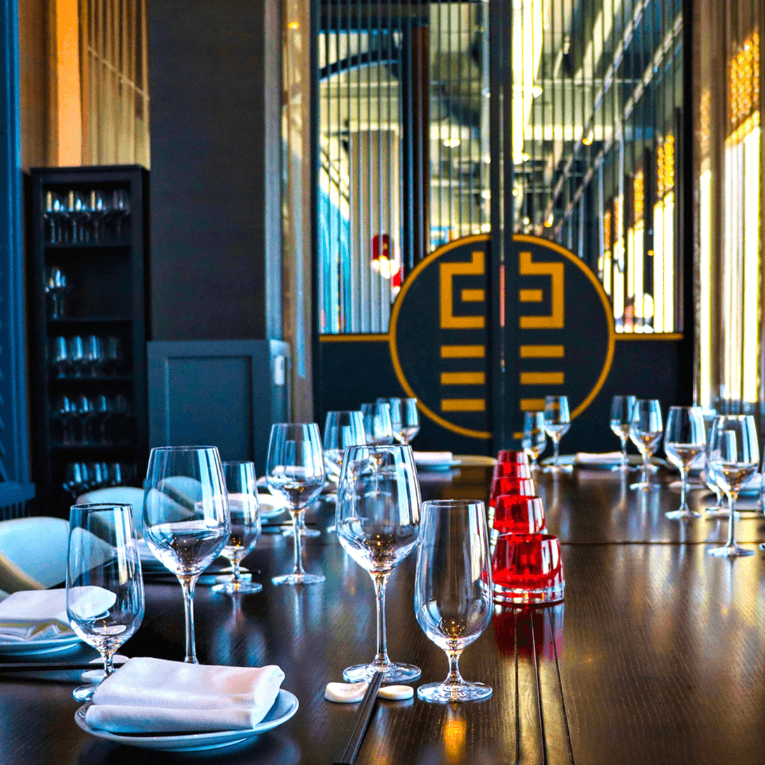 Private dining room at Empress by Boon, table set for dinner service