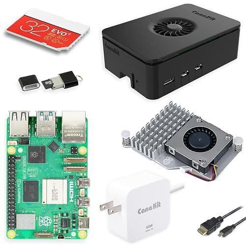 The contents of a CanaKit Raspberry Pi 5 Essentials Starter Kit, including the board, case, cooling fan, power supply, and memory card.