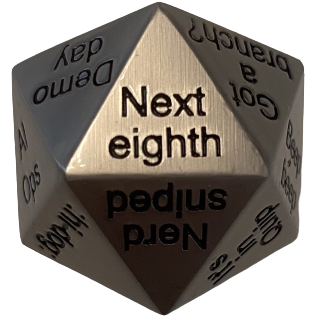 metal dice showing "next eighth" text