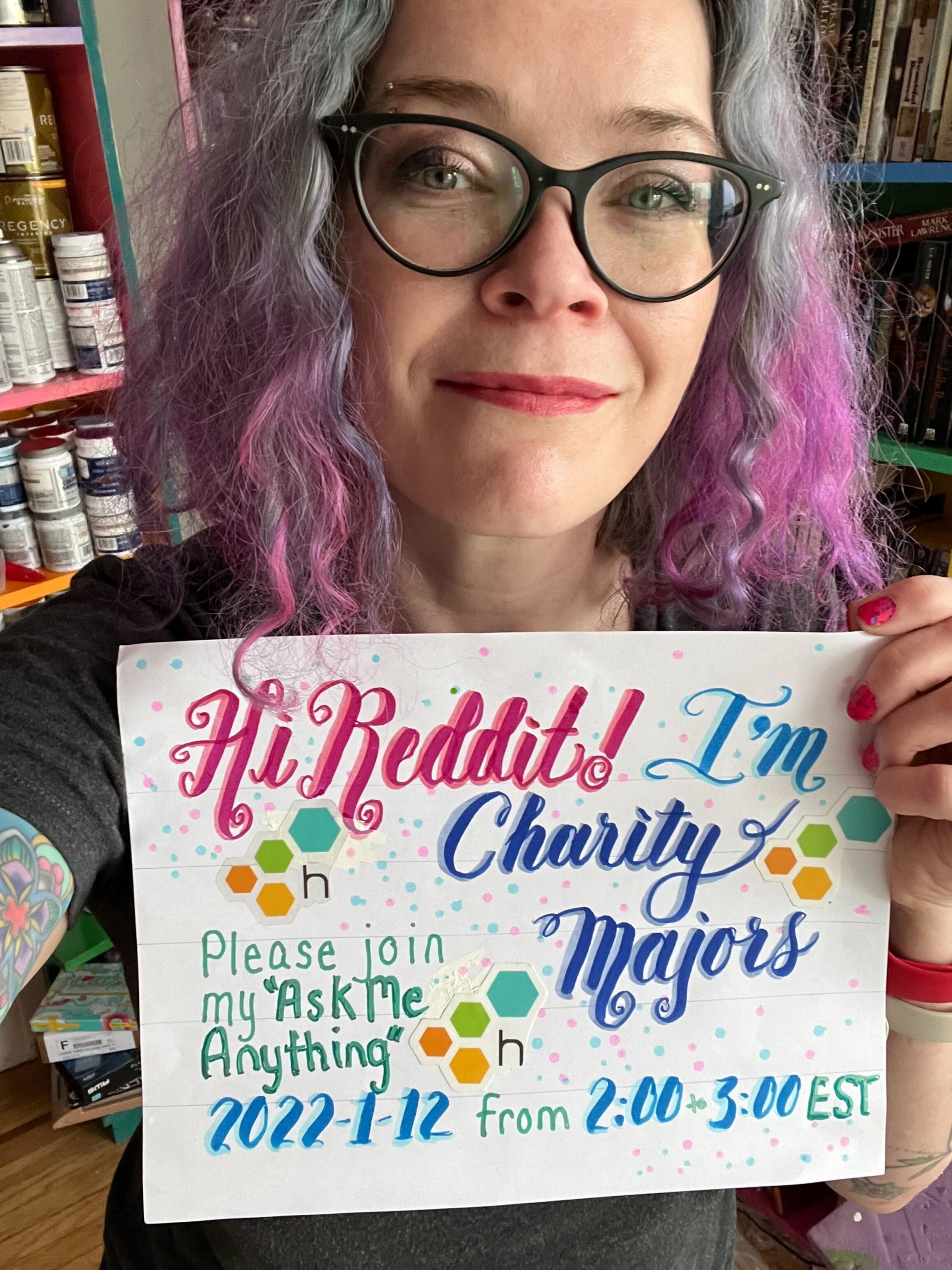 charity majors holding sign inviting reddit to join ama january 12, 2022