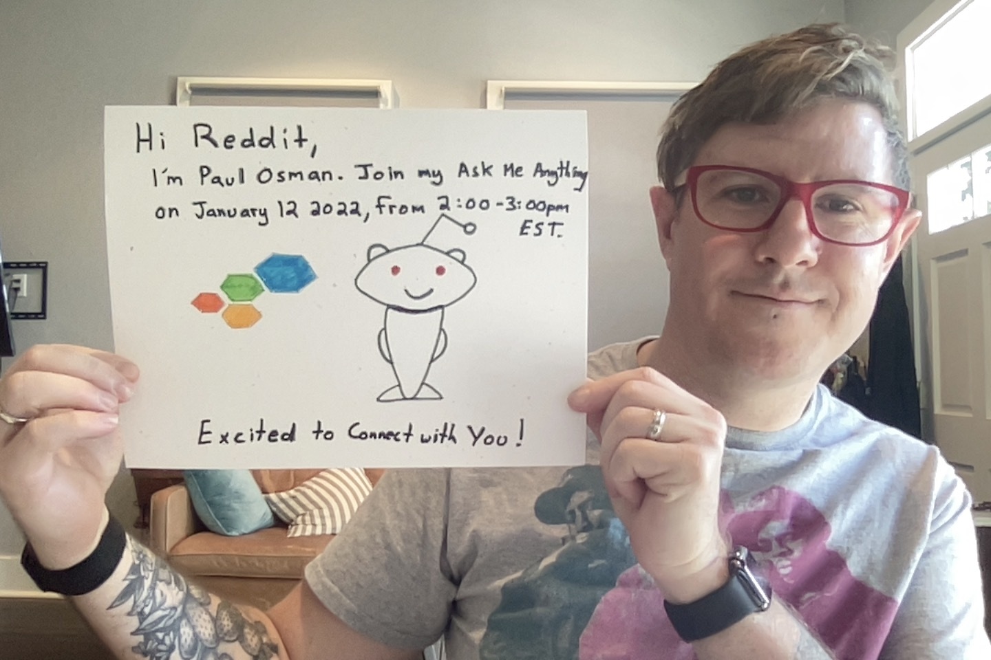 paul osman holding sign inviting reddit to join ama january 12, 2022