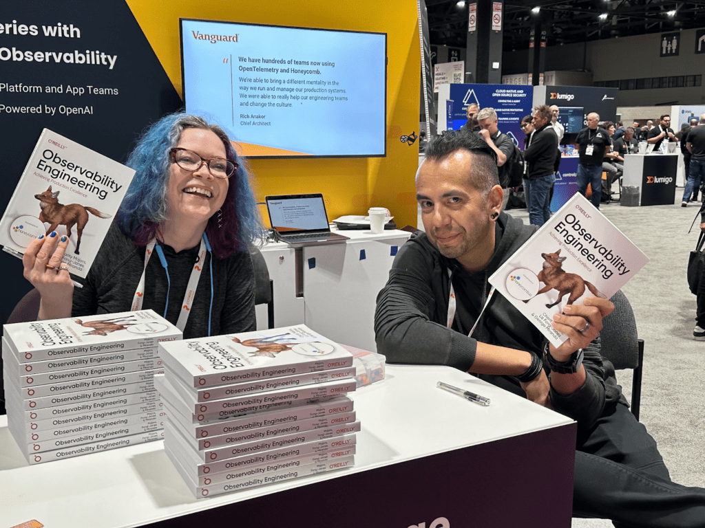 Kubecon 2023 - Book signing at the booth by Charity Majors and George Miranda.
